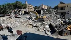 epa11629155 Excavators clear the rubble at the site of an Israeli strike in the village of Maaysra targeted on 25 September, in Byblos district, north of Beirut, Lebanon, 27 September 2024. Israel's military stated on 27 September, that the Israel Air Force (IAF) launched dozens of strikes targeting Hezbollah cells and infrastructure in several areas in southern Lebanon. EPA/WAEL HAMZEH