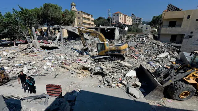 epa11629155 Excavators clear the rubble at the site of an Israeli strike in the village of Maaysra targeted on 25 September, in Byblos district, north of Beirut, Lebanon, 27 September 2024. Israel's military stated on 27 September, that the Israel Air Force (IAF) launched dozens of strikes targeting Hezbollah cells and infrastructure in several areas in southern Lebanon. EPA/WAEL HAMZEH