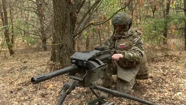 epa11622265 A still image taken from a handout video made available by the Russian Defence Ministry Press-Service on 24 September 2024 shows a Russian marine examines the US MK-19 belt-fed automatic mounted grenade launcher captured during fights with Ukrainian troops, at an undisclosed location in Kursk region, Russia. Troops of the ‘North’ group repelled five attempts by the Ukrainian armed forces to break through the Russian border in the Kursk direction in one day, the Russian Defense Ministry reported. Fighting between Russian and Ukrainian forces has been ongoing in the Kursk region since 06 August following a Ukrainian military incursion into Russia's border region. EPA/RUSSIAN DEFENCE MINISTRY PRESS SERVICE / HANDOUT HANDOUT EDITORIAL USE ONLY/NO SALES