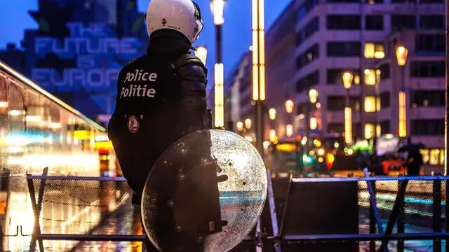 epaselect epa11181975 A police officer holds a shield while securing the Law Street in the European Quarter around the EU Commission Berlaymont building, in Brussels, Belgium, 26 February 2024. European farmers will gather on 26 February to demonstrate on the sidelines of a meeting of EU agriculture and fisheries ministers in Brussels. EPA/OLIVIER MATTHYS