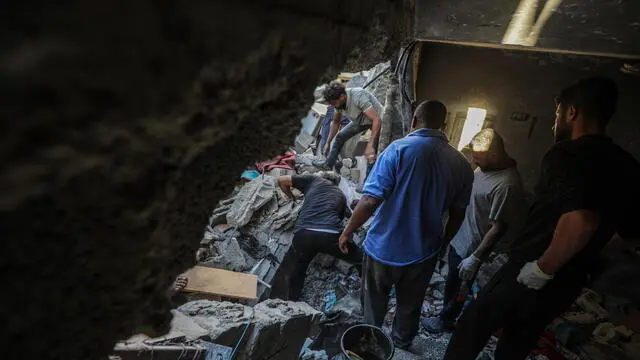 epa11668055 Palestinians search for bodies and survivors among the rubble of the destroyed house of the Al-Tilbany family following an Israeli air strike in Al-Maghazi refugee camp in the Gaza Strip, 19 October 2024. According to a report from the Ministry of Health in Gaza, at least eight members of the Shnaa family were killed following an Israeli air strike in the camp. More than 42,500 Palestinians and over 1,400 Israelis have been killed, according to the Palestinian Health Ministry and the Israel Defense Forces (IDF), since Hamas militants launched an attack against Israel from the Gaza Strip on 07 October 2023, and the Israeli operations in Gaza and the West Bank which followed it. EPA/MOHAMMED SABER