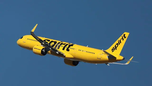 epa11012803 A Spirit Airlines airplane flies near Los Angeles International Airport in Los Angeles, California, USA, 05 December 2023. JetBlue Airways nears the end of a trial to persuade a judge in federal court to let it acquire Spirit Airlines, a deal that the Justice Department says will raise fares and reduce competition. JetBlue argues it needs to buy Spirit Airlines to compete with bigger airlines in a post-Covid travel world. EPA/ALLISON DINNER