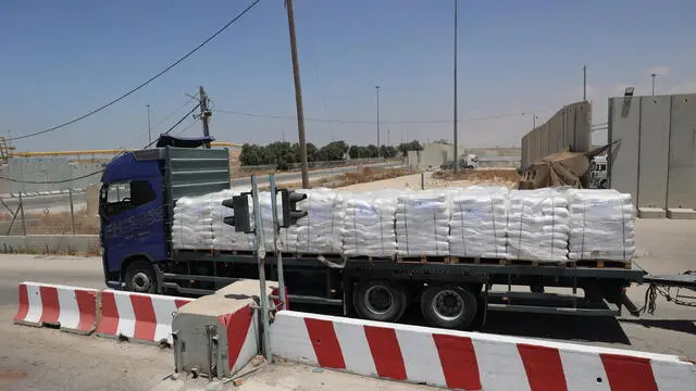 epa11379272 An aid truck arrives in the Gaza Strip at the Kerem Shalom crossing, southern Israel, 30 May 2024. According to Israel's Coordination of Government Activities in the Territories (COGAT) 30,000 aid trucks crossed into the Gaza Strip since Hamas militants launched an attack against Israel from the Gaza Strip on 07 October 2023. EPA/ABIR SULTAN