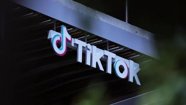 epa11298575 A sign is on display at TikTok in Los Angeles, California, USA, 24 April 2024. US President Biden signed on 24 April a law that would ban Chinese-owned TikTok unless it is sold within a year. EPA/ALLISON DINNER