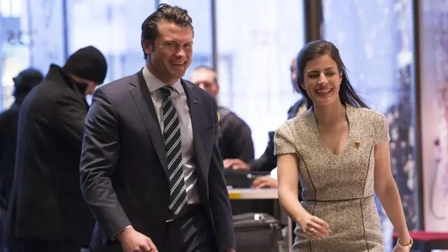 epa05677060 Pete Hegseth (L), a reported contender for the position of Veterans Affairs Secretary, walks in the lobby of Trump Tower in New York, New York, USA, 15 December 2016. EPA/Albin Lohr-Jones / POOL