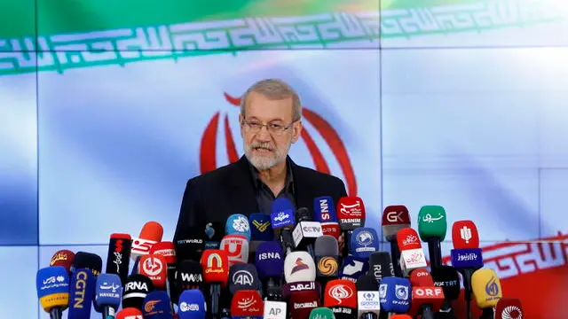 epa11381005 Former Iranian parliament speaker Ali Larijani speaks to the media after registering his candidacy during the first day of registration for the Iranian presidential election at the interior ministry in Tehran, Iran, 31 May 2024. Iran will hold presidential election on 28 June. EPA/ABEDIN TAHERKENAREH