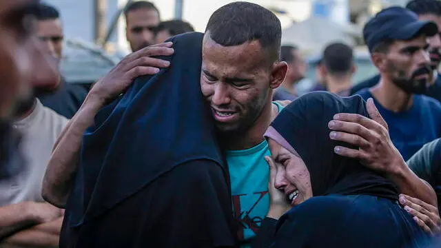 epaselect epa11648574 Relatives mourn during the funeral for Palestinians killed in an early morning Israeli airstrike on the Al Bureij refugee camp, at the Al Aqsa Martyrs Hospital in Deir Al Balah town, central Gaza Strip, 08 October 2024. More than 41,900 Palestinians and over 1,400 Israelis have been killed, according to the Palestinian Health Ministry and the Israel Defense Forces (IDF), since Hamas militants launched an attack against Israel from the Gaza Strip on 07 October 2023, and the Israeli operations in Gaza and the West Bank which followed it. EPA/MOHAMMED SABER