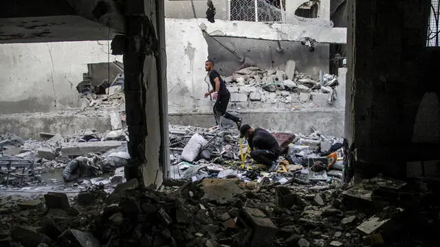 epa11617857 Internally displaced Palestinians search through the rubble in the Al-Zeitoun C school after an Israeli air strike in the Zaytoun area of Gaza City, 21 September 2024. According to the Palestinian Health Ministry in Gaza, at least 22 people were killed and dozens injured on 21 September after an Israeli strike hit a school in Gaza City which was being used as a shelter by internally displaced Palestinians. The Israeli Defense Forces (IDF) announced that the strike it conducted was targeting a Hamas control and command center, which was "embedded inside a compound that previously served as the Al Falah School." More than 41,300 Palestinians and over 1,400 Israelis have been killed, according to the Palestinian Health Ministry and the Israel Defense Forces (IDF), since Hamas militants launched an attack against Israel from the Gaza Strip on 07 October 2023, and the Israeli operations in Gaza and the West Bank which followed it. EPA/MAHMOUD ZAKI