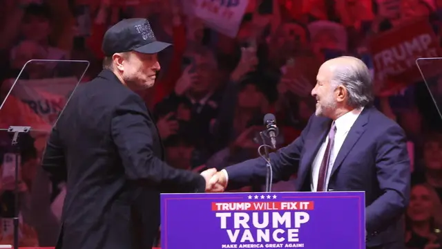 epa11688255 Howard Lutnick, Chairman and CEO of Cantor Fitzgerald (R), greets Elon Musk, businessman, (L), during a rally held for former US President and Republican presidential candidate Donald Trump, at Madison Square Garden in New York, New York, USA, 27 October 2024. Trump is facing US Vice President and Democratic presidential candidate Kamala Harris in the upcoming election on 05 November 2024. EPA/SARAH YENESEL