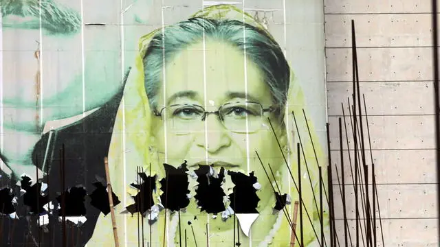 epa11529473 A vandalized image of Prime Minister Sheikh Hasina in the aftermath of her resignation, in Dhaka, Bangladesh, 06 August 2024. In an address to the nation, Chief of Army Staff General Waker-Uz-Zaman announced on 05 August that Prime Minister Sheikh Hasina has resigned after weeks of unrest and an interim government will be formed to run the country. A new curfew starting 06:00 p.m. local time was imposed on 04 August by Dhaka authorities following the initial one imposed by the Bangladeshi government on 20 July 2024, as casualties mounted and law enforcement struggled to contain the unrest. Violence broke out in Dhaka and other regions following student-led protests demanding reforms to the government's job quota system. EPA/MONIRUL ALAM