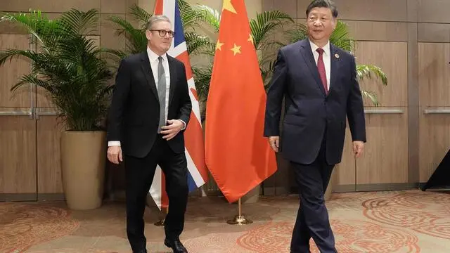 Britain's Prime Minister Keir Starmer (L) and China's President Xi Jinping leave after posing for a photograph during their bilateral meeting at the Sheraton Hotel, on the sidelines of G20 summit in Rio de Janeiro, Brazil on November 18, 2024. (Photo by Stefan Rousseau / POOL / AFP)