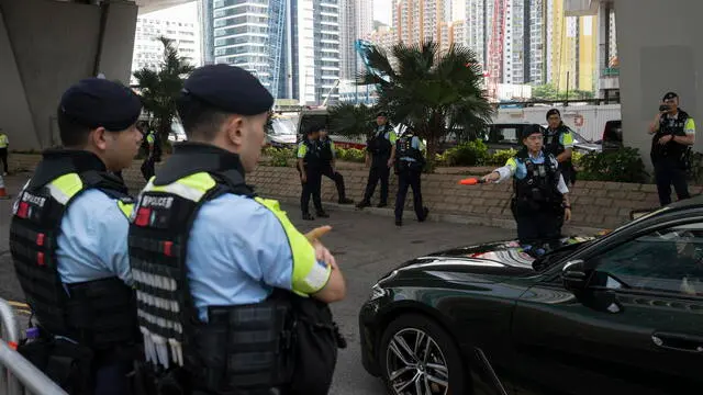 epa11435784 Police officers stand guardÂ outsideÂ the West Kowloon Magistrates' Courts in Hong Kong, China, 25 June 2024. The court is set to hear mitigation pleas from the 45 defendants convicted under the national security law. EPA/LEUNG MAN HEI