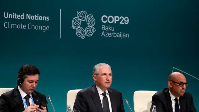 epa11727304 (L-R) Azerbaijan COP29 lead negotiator Yalchin Rafiyev, COP29 President Mukhtar Babayev and Executive Secretary of the United Nations Framework Convention on Climate Change (UNFCCC) Simon Stiell attend a press conference at the UN Climate Change Conference COP29 in Baku, Azerbaijan, 18 November 2024. The Azerbaijani capital of Baku hosts the 2024 United Nations Climate Change Conference (COP29) from 11 to 22 November 2024. EPA/IGOR KOVALENKO