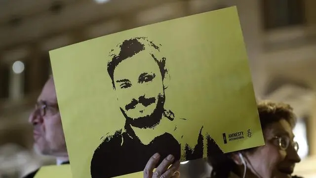 People during a march and torchlight procession in memory of the Italian researcher Giulio Regeni, who was abducted, tortured and murdered in Cairo (Egypt), in Rome, Italy, 25 January 2018. ANSA/RICCARDO ANTIMIANI