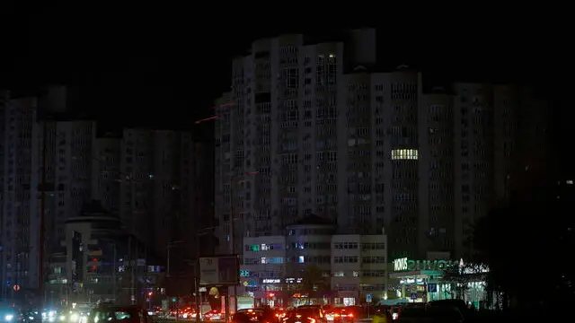 epa11727881 Cars transit along a road among residential buildings in the dark during a scheduled power cut in Kyiv, Ukraine, 18 November 2024, amid the Russian invasion. Ukraine's national power supply Ukrenergo announced on 18 November, that power cuts have been applied throughout the country due to emergency shutdown of units at several power plants as a result of waves of Russian missile attacks on the energy infrastructure. Russian forces launched a large-scale attack across Ukraine on 17 November, with around 120 missiles and 90 unmanned aerial vehicles (UAVs). The main targets of the attack were Ukraine's energy infrastructure, Ukrainian President Zelensky said. Russian troops entered Ukrainian territory on 24 February 2022, starting a conflict that has provoked destruction and a humanitarian crisis. EPA/SERGEY DOLZHENKO