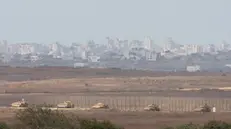 epa11645083 A convoy of Israeli armoured vehicles makes its way to the northern Gaza Strip, as seen from the border with Gaza in southern Israel, 06 October 2024. Israel's military stated on 06 October, they have been conducting since last night an 'operation to systematically dismantle terrorist infrastructure' in the area of Jabalia, in the northern Gaza Strip. The Israel Air Force conducted strikes on dozens of military targets in order to assist IDF ground troops operating in the area, the statement added. EPA/ABIR SULTAN