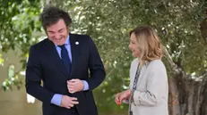 Italian Prime Minister Giorgia Meloni (R) welcomes Argentina's President Javier Milei (L) during the G7 Borgo Egnazia Summit, in Borgo Egnazia (Brindisi) southern Italy, 14 June 2024. The G7 Borgo Egnazia Summit will be held from 13 to 15 June 2024. ANSA/ETTORE FERRARI