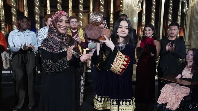 epa11729670 Yemeni journalist and politician Tawakkol Karman, who was awarded the Nobel Peace Prize in 2011 (L) hands Afghanistan's 17-year-old activist Nila Ibrahimi (R) the International Children's Peace Prize 2024 at the Nieuwe Kerk, Amsterdam, the Netherlands, 19 November 2024. Ibrahimi received the prize for her work for the rights of girls in Afghanistan. EPA/JEROEN JUMELET