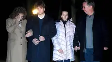 epa08985055 The family of Captain Sir Tom Moore (L-R), daughter Hannah, grandson Benji, granddaughter Georgia and son-in-law Colin Ingram participate in a doorstep clap in his memory near their home near Milton Keynes, Britain, 03 February, 2021. According to Moore's family, 100-year old Tom Moore, who raised about 33 million British pounds (almost 37 million euros) for Britain's National Health Service (NHS) died 02 February 2021. Moore was taken to a hospital 31 January 2021 after testing positive for Covid-19 and having problems with breathing. EPA/NEIL HALL