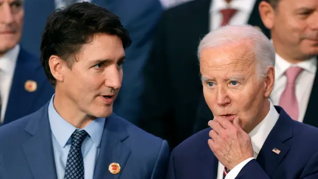 epa11729504 US President Joe Biden (R) and Canadian Prime Minister Justin Trudeau (L) take part in an official photo at the end of the second day of the G20 Summit of Heads of State, in Rio de Janeiro, Brazil, 19 November 2024. The G20 Summit brings together leaders from 55 nations and organizations on 18 and 19 November at the Museum of Modern Art in Rio de Janeiro. EPA/ANDRE COELHO