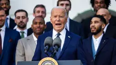 epa11733869 US President Joe Biden (C) welcomes the 2024 NBA champion Boston Celtics to the White House in Washington, DC, USA, 21 November 2024. President Biden accepted a Celtics jersey with his name on it from Celtics players Jayson Tatum and Derrick White. EPA/JIM LO SCALZO / POOL