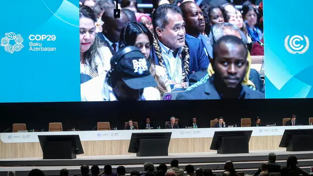 epa11732389 COP29 President Mukhtar Babayev (C) attends a plenary session at the United Nations Climate Change Conference COP29 in Baku, Azerbaijan, 21 November 2024. The Azerbaijani capital of Baku hosts the 2024 United Nations Climate Change Conference (COP29) from 11 to 22 November 2024. EPA/IGOR KOVALENKO