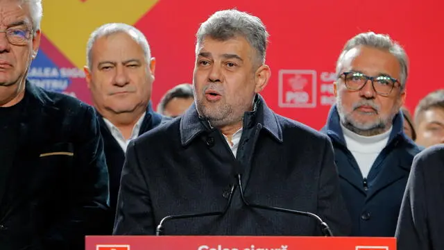 epa11738932 Prime minister Marcel Ciolacu (C), leader of the PSD (Social Democracy Party) party and presidential candidate delivers his speech at the PSD campaign headquarters after the first exit-poll, in Bucharest, Romania, 24 November 2024. According to the first exit-poll results, Social Democrat Prime Minister Marcel Ciolacu was leading with around 25 percent, while center-right politician Elena Lasconi of the Save Romania Union party, came in second and will likely face a run-off with Ciolacu on 08 December. Simionâ€™s AUR won 15 percent of votes. EPA/BOGDAN CRISTEL