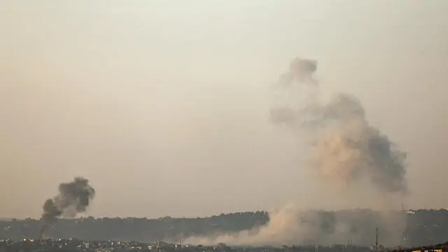 epa11734833 Smoke rises as a result of an Israeli airstrike on the village of Al-Khiam in southern Lebanon, as seen from the Israeli side of the border, northern Israel, 22 November 2024, amid cross-border hostilities between Hezbollah and Israel. Israel's military stated on 22 November, that following sirens that sounded in the Haifa Bay area, approximately five projectiles were identified crossing from Lebanon into Israeli territory. EPA/ATEF SAFADI