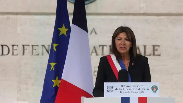 epa11564429 Paris Mayor Anne Hidalgo delivers a speech during a ceremony commemorating the 80th anniversary of the Liberation of Paris next to the Denfert Rochereau Square in Paris, France, 25 August 2024. Nazi Germany surrendered Paris on 25 August 1944 following the French Resistance uprising during World War II. EPA/TERESA SUAREZ / POOL