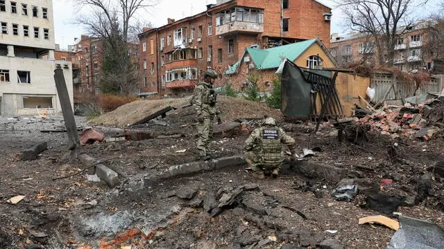 epaselect epa11739473 Ukrainian experts inspect the damage at the site of a missile strike that hit central Kharkiv, northeastern Ukraine, 25 November 2024, amid the Russian invasion. At least 23 people were injured as a result of a missile strike that hit Kharkiv on 25 November morning, the State Emergency Service of Ukraine (SESU) reported. Russian troops launched 145 'shock' drones across Ukraine overnight and several ballistic missiles to Odesa and Kharkiv in the morning, according to the Air Force Command of Ukraine. Russian troops entered Ukrainian territory on 24 February 2022, starting a conflict that has provoked destruction and a humanitarian crisis. EPA/SERGEY KOZLOV