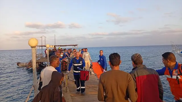 epa11739995 Medics and people wait for possible survivors after a boat sank at a harbour in Marsa Alam, Red Sea Governorate, in Egypt 25 Novermber 2024. Red Sea Governor Major General Amr Hanafi reported that rescue efforts had successfully rescued 28 people from the tourist launch 'Sea Story' sinking accident north of Marsa Alam thus far. Searches are still underway to locate the other 17 passengers who have gone missing. EPA/STR