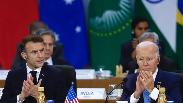 epa11727494 US President Joe Biden (R) and French President Emmanuel Macron participate at the opening of the G20 Summit of Heads of State in Rio de Janeiro, Brazil, 18 November 2024. The G20 summit will bring together leaders from 55 nations and organizations on 18 and 19 November at the Museum of Modern Art in Rio de Janeiro. EPA/ANTONIO LACERDA