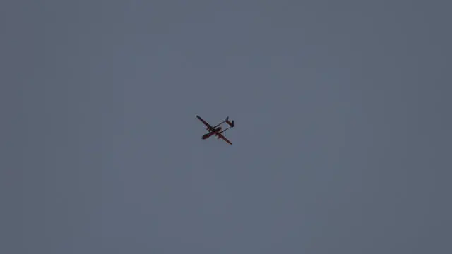 epa11731362 A drone flies near Kafr Dan village near the West Bank city of Jenin, 20 November 2024. According to the Palestinian Ministry of Health at least one person has been killed in the airstrike. Since 07 October 2023, nearly 750 Palestinians have been killed and around 6,500 have been injured across the West Bank and Jerusalem, according to the UN Office for the Coordination of Humanitarian Affairs (OCHA). EPA/ALAA BADARNEH