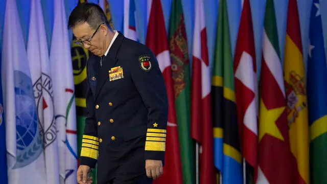 epa11601282 Minister of National Defense of China Admiral Dong Jun leaves the stage after speaking during the opening ceremony of the 11th Beijing Xiangshan Forum in Beijing, China, 13 September 2024. The 11th Beijing Xiangshan Forum is held between 12 and 14 September 2024 in Beijing, China. EPA/ANDRES MARTINEZ CASARES