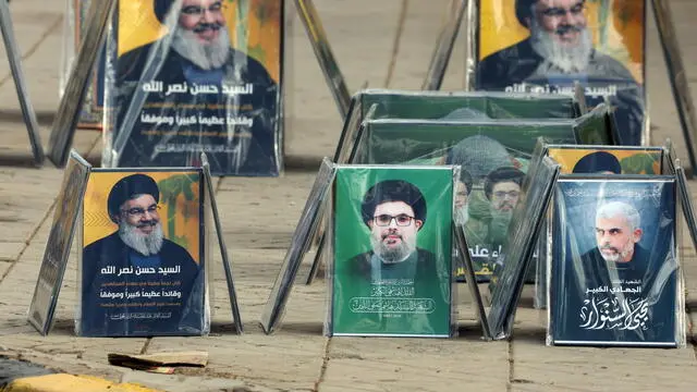 epa11683525 Portraits of late leaders of Hezbollah and Hamas are displayed for sale on a street in Sana'a, Yemen, 25 October 2024. Hassan Nasrallah was killed in an Israeli strike on Beirut on 27 September. The Israeli Army, Tsahal, on 17 October 2024 confirmed that Hamas leader Yahya Sinwar was 'eliminated' on 16 October 'after a year-long pursuit'. EPA/YAHYA ARHAB