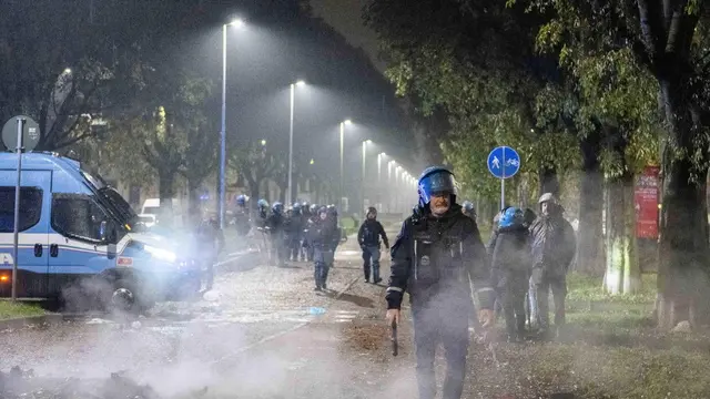 epa11741113 Police on duty at the Corvetto neighborhood in Milan, northern Italy, 26 November 2024. About a hundred young people protested in the Corvetto neighborhood overnight, and the day before, on a nearby road, after the death of Ramy Elgaml, a 19-year-old who died in a road accident on the night between 23 and 24 November on a scooter during a chase by the Carabinieri police. EPA/ANDREA FASANI