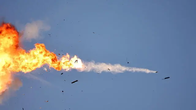 epa11563762 A Hezbollah unmanned aerial vehicle (UAV) crossing from Lebanon gets intercepted by an Israeli fighter jet over an area near the Lebanon-Israel border, as seen from northern Israel, 25 August 2024. The Israeli military stated that Israeli Air Force fighter jets are currently striking targets belonging to the Hezbollah organization that posed an imminent threat to the citizens of the State of Israel. EPA/ATEF SAFADI