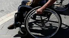 epa09617108 A disabled Yemeni rides a wheelchair on the eve of the International Day of Persons with Disabilities, at a street in Sanaâ€™a, Yemen, 02 December 2021. Approximately three million people with disabilities live in war-ridden Yemen, UNICEF has estimated. The International Day of People with Disability, inaugurated by the United Nations in 1992, is annually observed on 03 December around the world to mobilize support for rights and well-being of persons with disabilities in all spheres of society and development. EPA/YAHYA ARHAB