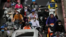 epa11254126 People commute on a street of Hanoi, Vietnam, 01 April 2024. According to the recent air quality index (AQI) ranking by Air Visual, Hanoi is among the most polluted cities in the world. EPA/LUONG THAI LINH