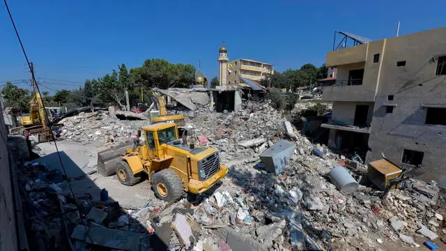 epa11629158 Excavators clear the rubble at the site of an Israeli strike in the village of Maaysra targeted on 25 September, in Byblos district, north of Beirut, Lebanon, 27 September 2024. Israel's military stated on 27 September, that the Israel Air Force (IAF) launched dozens of strikes targeting Hezbollah cells and infrastructure in several areas in southern Lebanon. EPA/WAEL HAMZEH