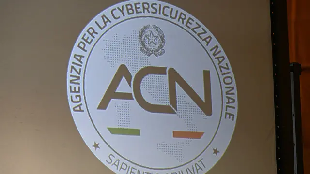 Lo stemma ACN (agenzia per la cybersicurezza nazionale), durante il convegno Cset conference 2024, cybersecurety for energy & transport infrastructures, alla sala della Grida dell'ex palazzo della Borsa. Genova, 12 novembre 2024. ANSA/LUCA ZENNARO