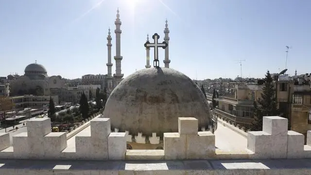 epa05767359 A general elevated view of a church and a mosque in Aleppo, northern Syria, 02 February 2017. The Syrian army recaptured last month the eastern neighborhoods of Aleppo that were held by gunmen for more than four years. EPA/YOUSSEF BADAWI