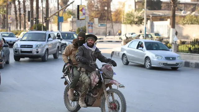 epa11750027 Opposition fighters in Aleppo, Syria, 30 November 2024, following a large offensive by rebel forces November 27, taking large parts of the country's second biggest city. The offensive triggered Russian strikes on Aleppo 30 November 2024, the first since 2016, and saw Syria's military withdraw its troops from the city. The attack was led by the Islamist militant group Hayat Tahrir al-Sham (HTS). EPA/Mohammed Al-Rifai