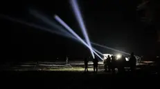 epa11049425 Ukrainian servicemen of the 241st Brigade of Territorial Defense operate search lights after an air raid alarm in the Kyiv region, Ukraine, 29 December 2023. At least 18 people have died and over 130 were injured after Russia launched a wave of airstrikes across Ukraine, Ukraine's Ministry of Internal Affairs said on 29 December. Strikes were reported in Kyiv, Lviv, Odesa, Dnipro, Kharkiv, Zaporizhzhia, and other Ukrainian cities. Russia launched 'more than 150 missiles and combat drones' at Ukrainian cities, Ukraine's Prosecutor General Andriy Kostin said in a statement, adding that extensive damage included residential buildings, educational institutions and hospitals. Russian troops entered Ukrainian territory on 24 February 2022, starting a conflict that has provoked destruction and a humanitarian crisis. EPA/Oleg Petrasyuk