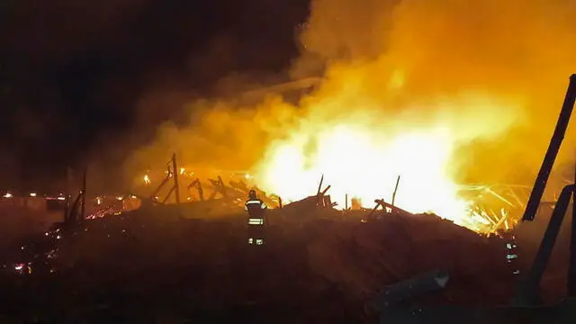 epa10787311 A handout picture made available by the Khmelnytskyi Regional Military Administration shows Ukrainian rescuers putting out a fire at a corn waste warehouse after shelling near Starokostiantyniv, Khmelnytskyi region, western Ukraine, 06 August 2023, amid the Russian invasion. Ukraine was attacked by more than 70 missiles and shock drones in the night between 05 August and 06 August, with 30 rockets of different classes and 27 shock drones being shot down, according to a statement by the Ukrainian Air Force. Russian troops entered Ukrainian territory in February 2022, starting a conflict that has provoked destruction and a humanitarian crisis. EPA/KHMELNYTSKYI REGIONAL MILITARY ADMINISTRATION HANDOUT -- MANDATORY CREDIT: KHMELNYTSKYI REGIONAL MILITARY ADMINISTRATION -- BEST QUALITY AVAILABLE -- HANDOUT EDITORIAL USE ONLY/NO SALES