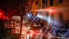 epaselect epa11753572 Police use water cannons to disperse Georgian opposition supporters protesting in front of the Parliament building in Tbilisi, Georgia, 02 December 2024. Thousands of pro-EU activists demonstrated in the Georgian capital to protest against the country's ruling party decision to suspend accession talks with the European Union (EU) until the end of 2028. EPA/DAVID MDZINARISHVILI