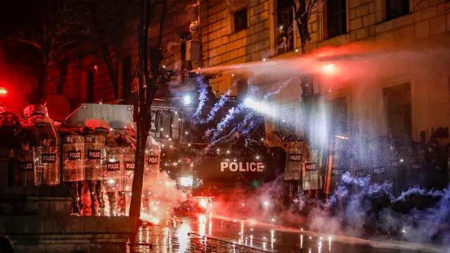 epaselect epa11753572 Police use water cannons to disperse Georgian opposition supporters protesting in front of the Parliament building in Tbilisi, Georgia, 02 December 2024. Thousands of pro-EU activists demonstrated in the Georgian capital to protest against the country's ruling party decision to suspend accession talks with the European Union (EU) until the end of 2028. EPA/DAVID MDZINARISHVILI