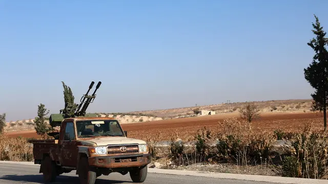 epa11754241 A Syrian opposition military vehicle drives on the Damascus-Aleppo International Highway in the province of Hama, Syria, 03 December 2024. Syrian opposition forces, led by the Islamist militant group Hayat Tahrir al-Sham (HTS), launched an offensive on 27 November, taking large parts of Aleppo, Syria's second-largest city. The offensive triggered counterattacks by the Syrian regime forces as well as Russian and Syrian airstrikes on opposition-controlled areas. EPA/MOHAMMED AL RIFAI