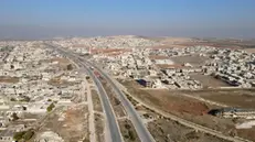 epa11754240 An aerial view shows the Damascus-Aleppo International Highway and the city of Khan Sheikhoun after it was captured by Syrian opposition militants in Idlib countryside, Syria, 03 December 2024. Syrian opposition forces, led by the Islamist militant group Hayat Tahrir al-Sham (HTS), launched an offensive on 27 November, taking large parts of Aleppo, Syria's second-largest city. The offensive triggered counterattacks by the Syrian regime forces as well as Russian and Syrian airstrikes on opposition-controlled areas. EPA/MOHAMMED AL RIFAI