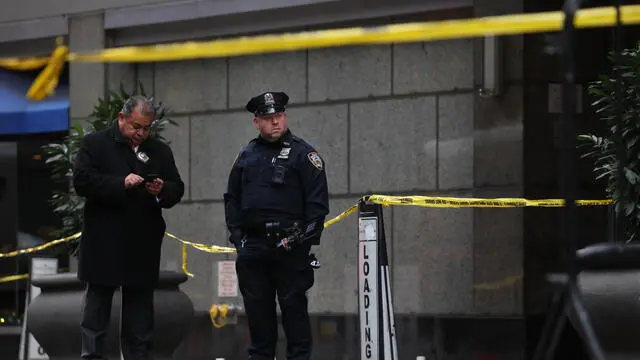 epa11756729 Police investigators at the scene where UnitedHealthcareâ€™s CEO Brian Thompson was shot and killed in an apparent targeted attack as he was en-route to to attend UnitedHealthcareâ€™s annual investor conference in New York, New York, USA, 04 December 2024. The masked gunman is still being sought following the early morning shooting in Manhattan after fleeing towards Central Park. EPA/JUSTIN LANE